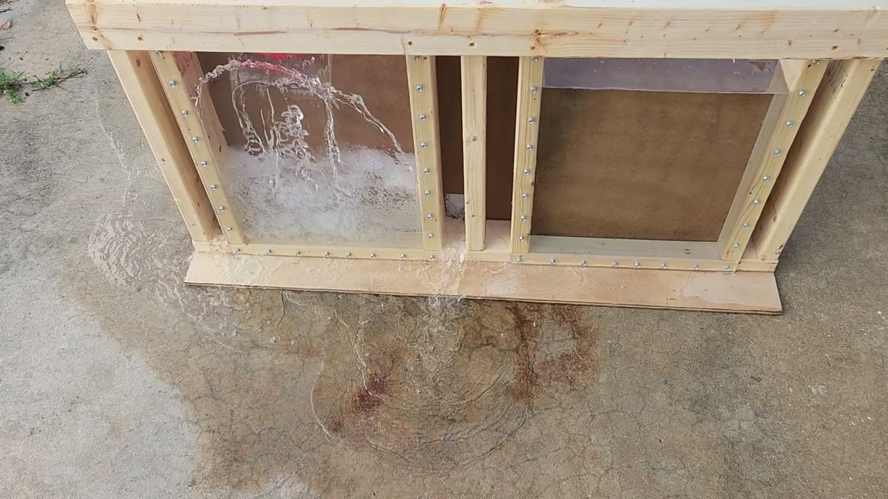Water draining out of the base of a framed wall fitted with Rock Bloks